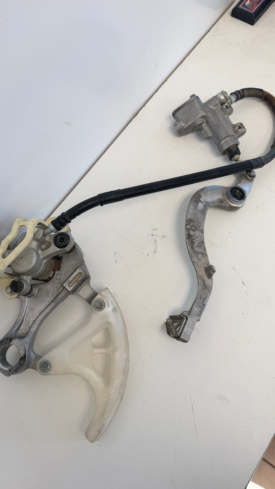 2010-2018 Suzuki RMZ250 OEM Rear Brake Complete Assembly Master Cylinder Caliper Pedal - 59300-37F10-999 - 69604-28H00