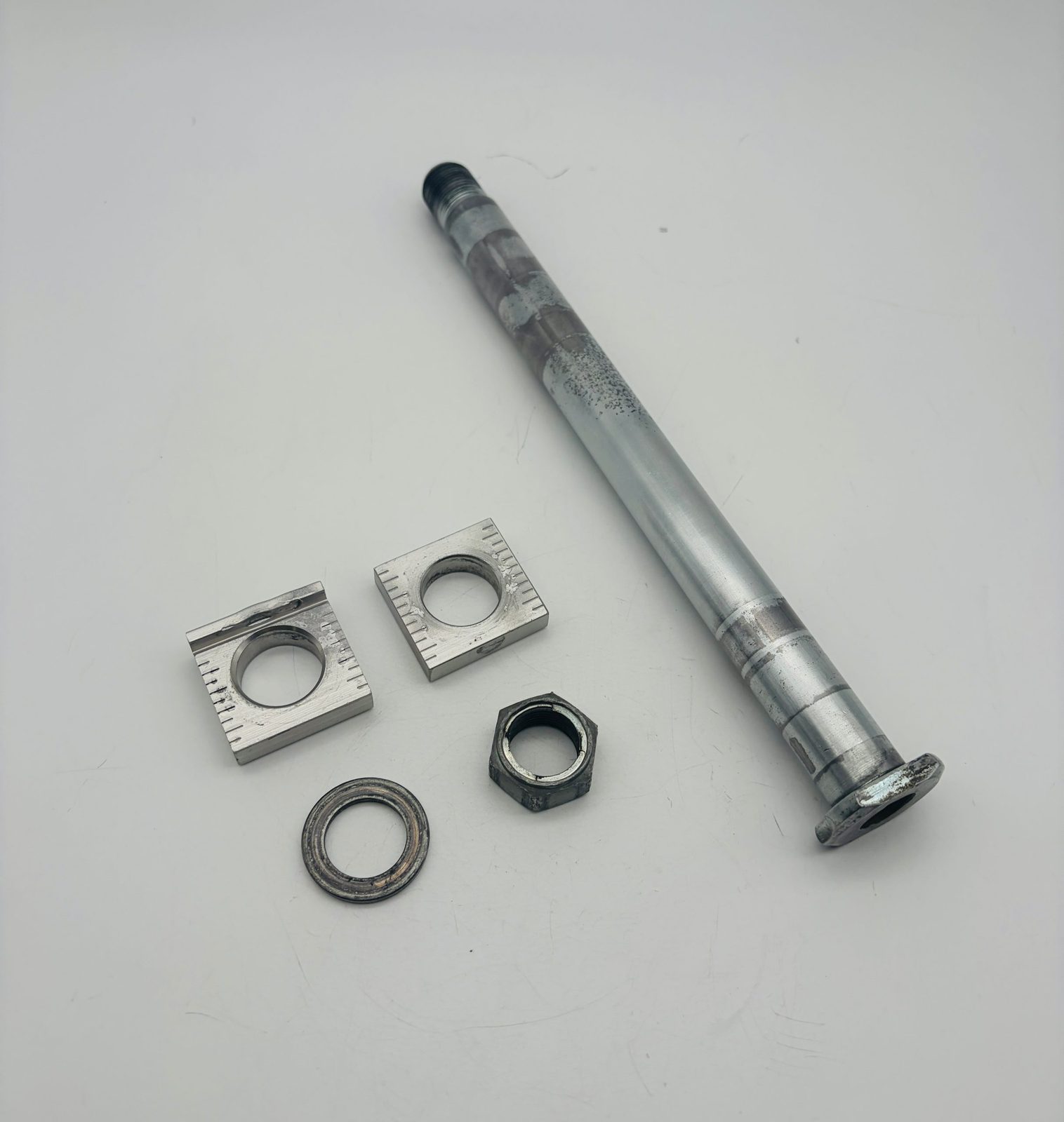 2005-2021 Yamaha YZ125 OEM Rear Axle with Chain Adjuster Blocks Spacer and Nut Complete Assembly 1C3-25381-90-00